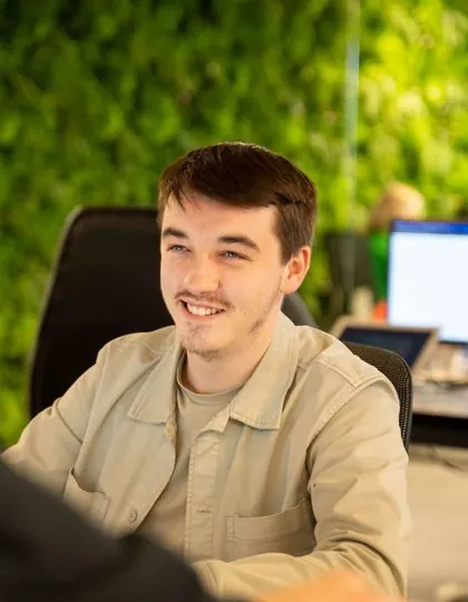 A member of the Lead Pronto team at the office green wall