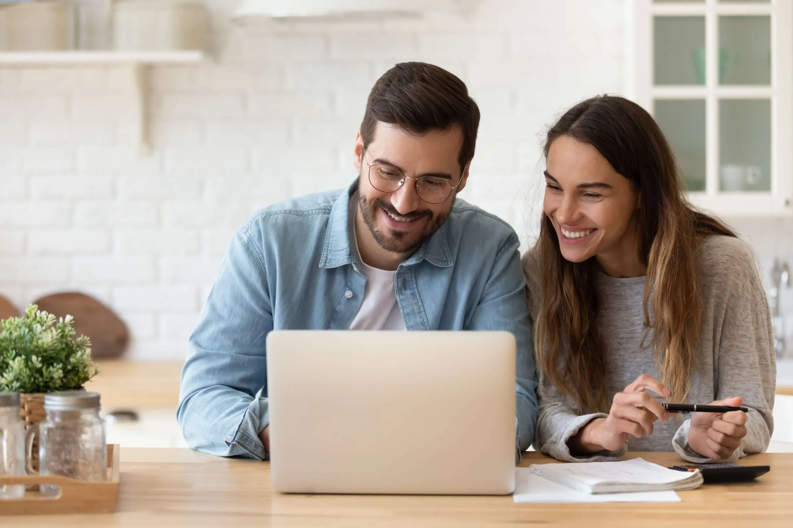 A couple reviewing their life insurance options online